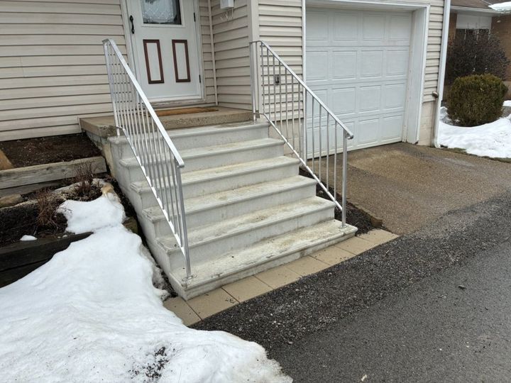 Raw aluminum stock railing in Evans City