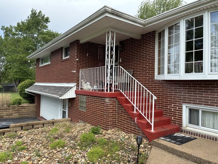 White aluminum porch railing with a scroll post in Apollo