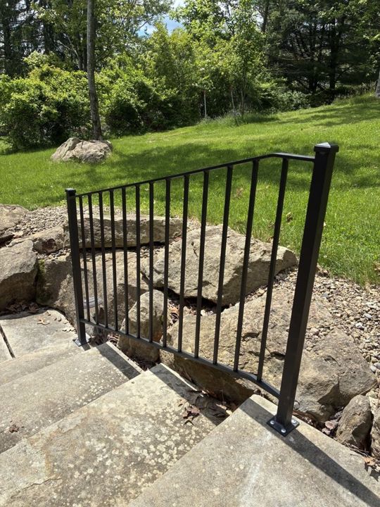 Matte textured black aluminum railing with pyramid post caps